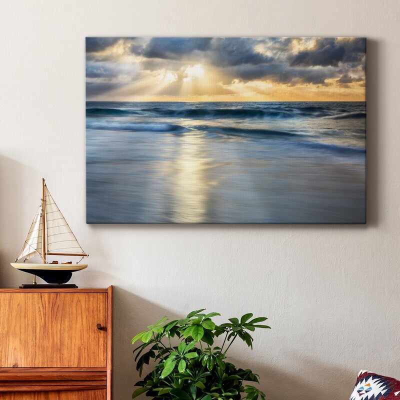Tranquil Shoreline: Serene Ocean Waves Under a Dramatic Cloudscape