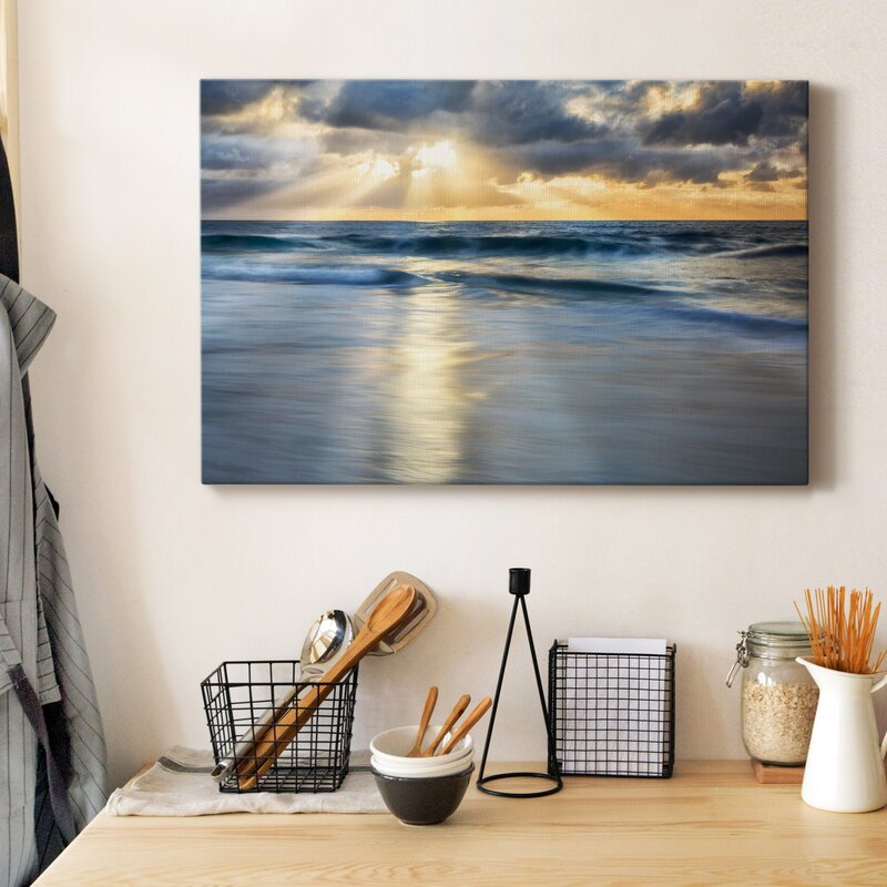Tranquil Shoreline: Serene Ocean Waves Under a Dramatic Cloudscape