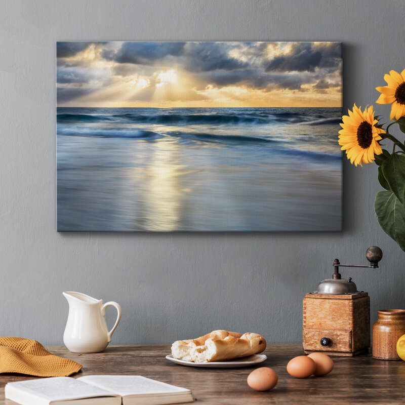 Tranquil Shoreline: Serene Ocean Waves Under a Dramatic Cloudscape