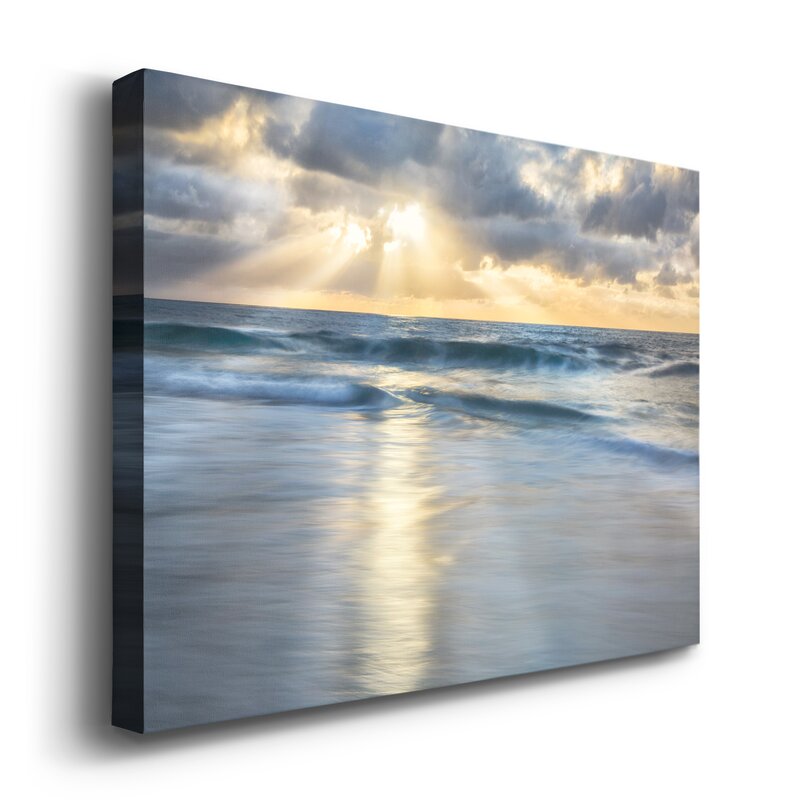Tranquil Shoreline: Serene Ocean Waves Under a Dramatic Cloudscape