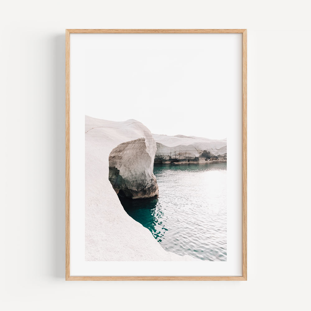 Serene Coastal Landscape: Vibrant Azure Waters and Majestic Stone Formations