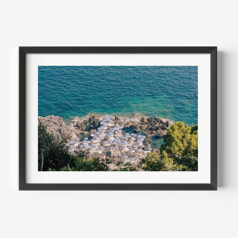 Serene Capri Beach Scene with Coastal Umbrellas and Azure Waters