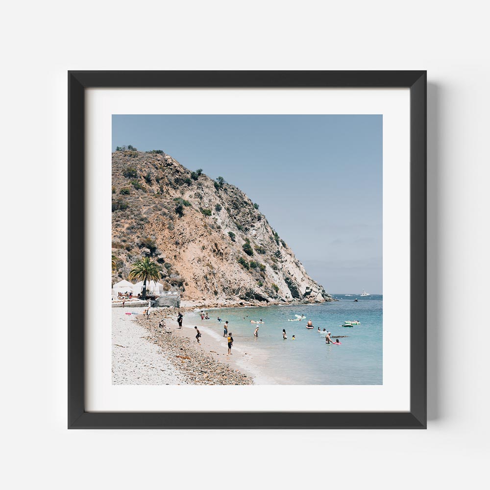 Tranquil Beach Scene with Sunbathers and Clear Waters