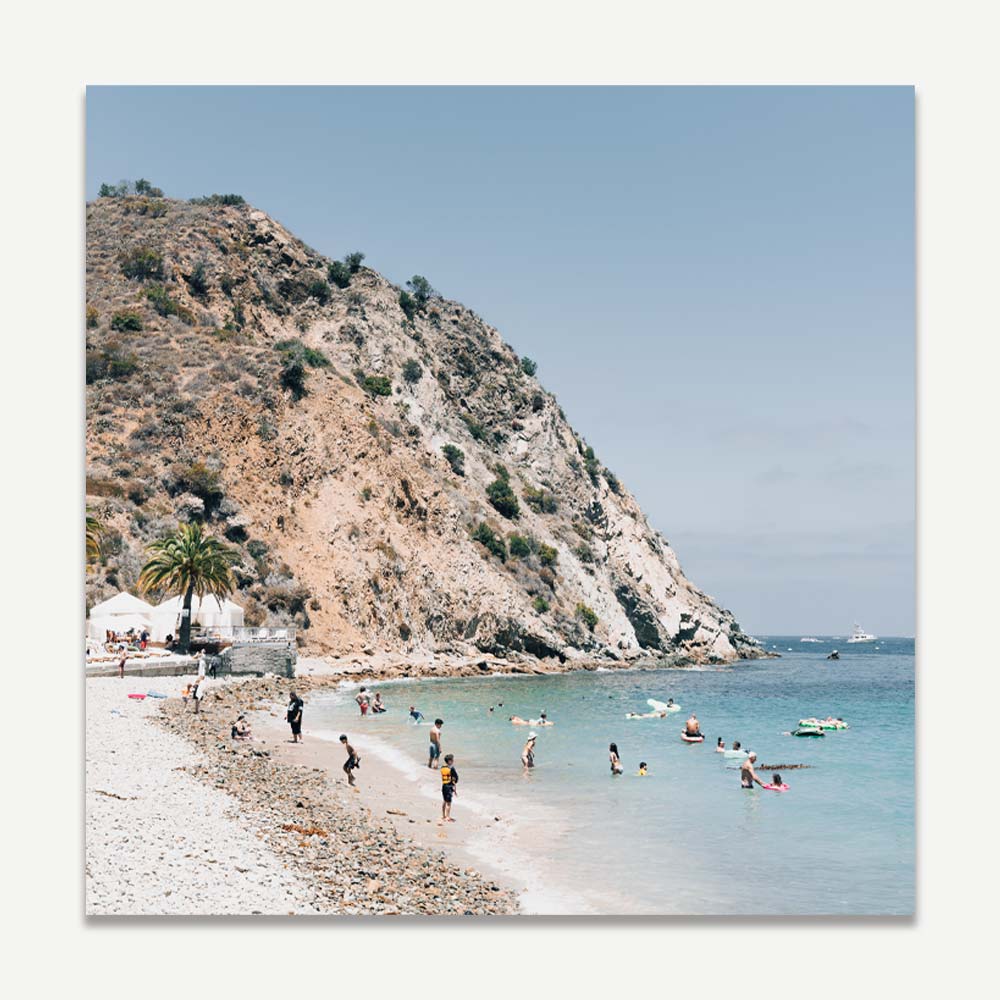 Tranquil Beach Scene with Sunbathers and Clear Waters
