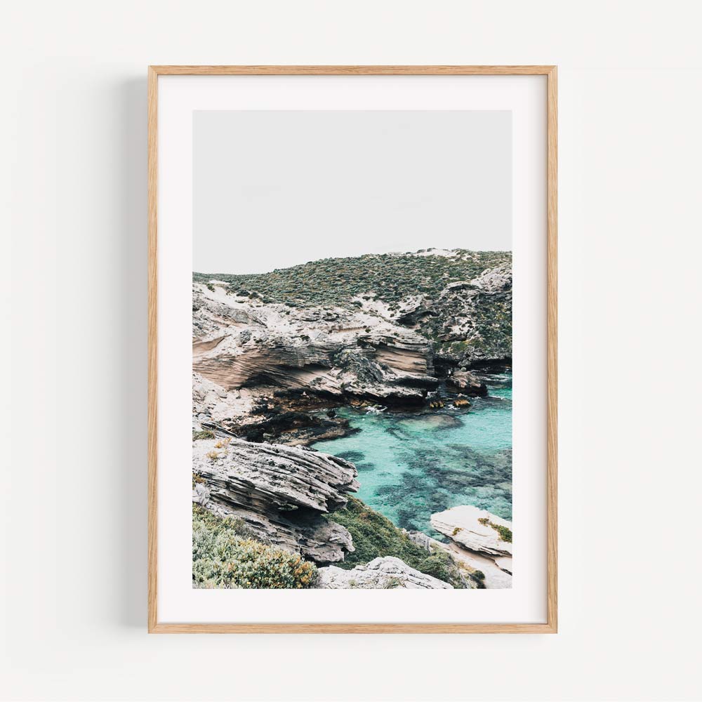Serene Coastal Landscape with Crystal Clear Waters and Rugged Cliffs