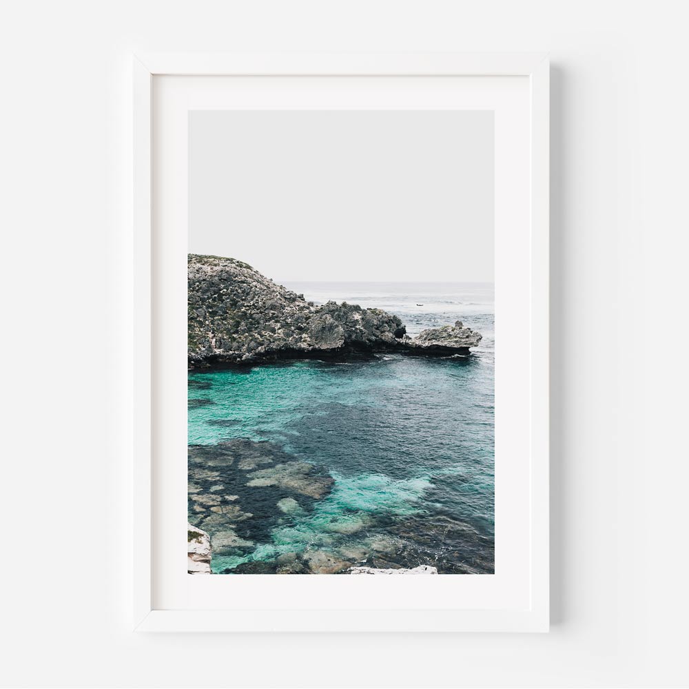 Serene Coastal View with Crystal Clear Water and Lush Greenery