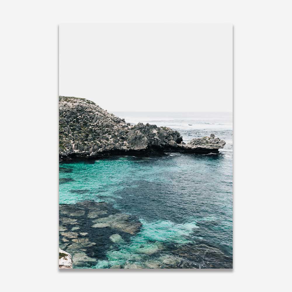 Serene Coastal View with Crystal Clear Water and Lush Greenery