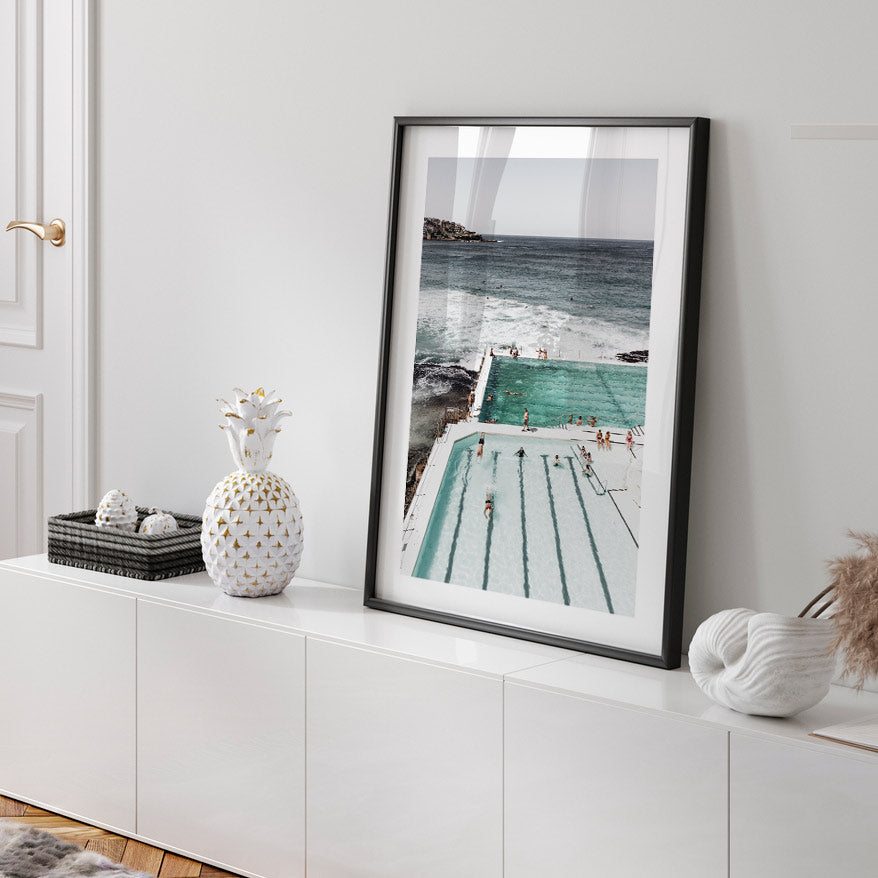 Serene Ocean Poolside Retreat with Bathers and Majestic Waves