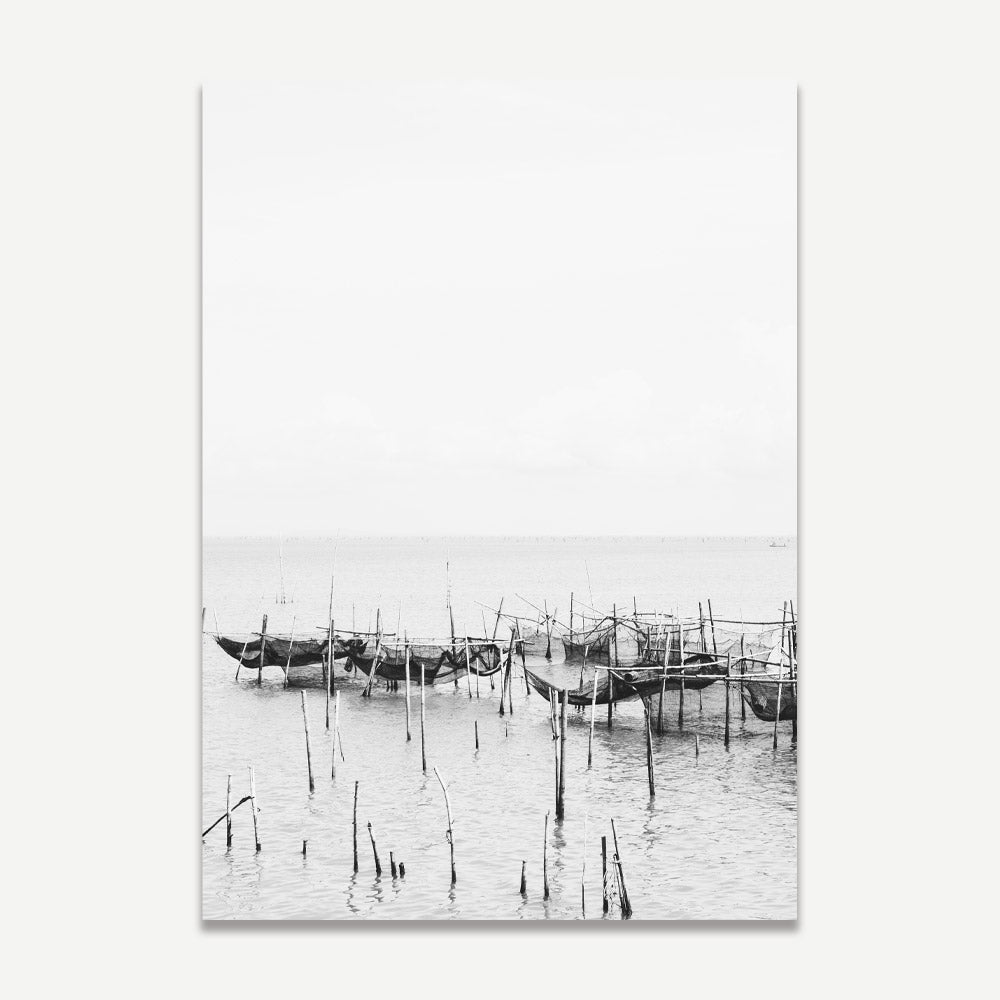 Serene Coastal Scene: Black and White Fishing Boats Reflected in Tranquil Waters