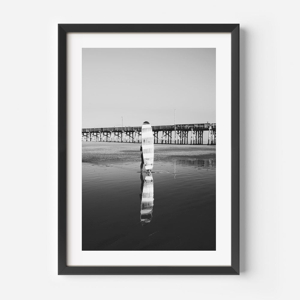 Black and White Longboard Surfer Reflection at Ocean Pier Sunset