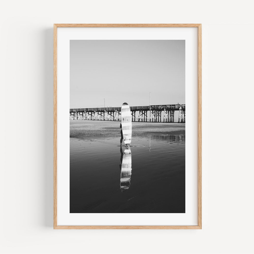 Black and White Longboard Surfer Reflection at Ocean Pier Sunset