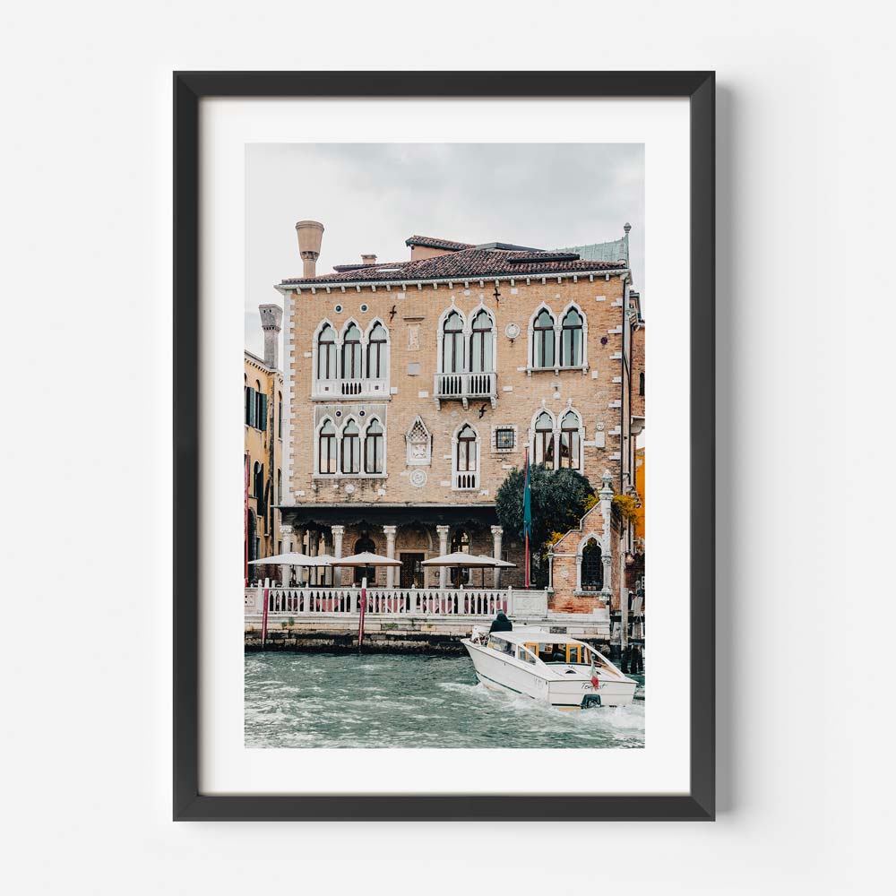 Charming Venetian Waterfront with Boat and Historic Architecture