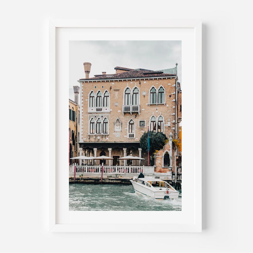 Charming Venetian Waterfront with Boat and Historic Architecture