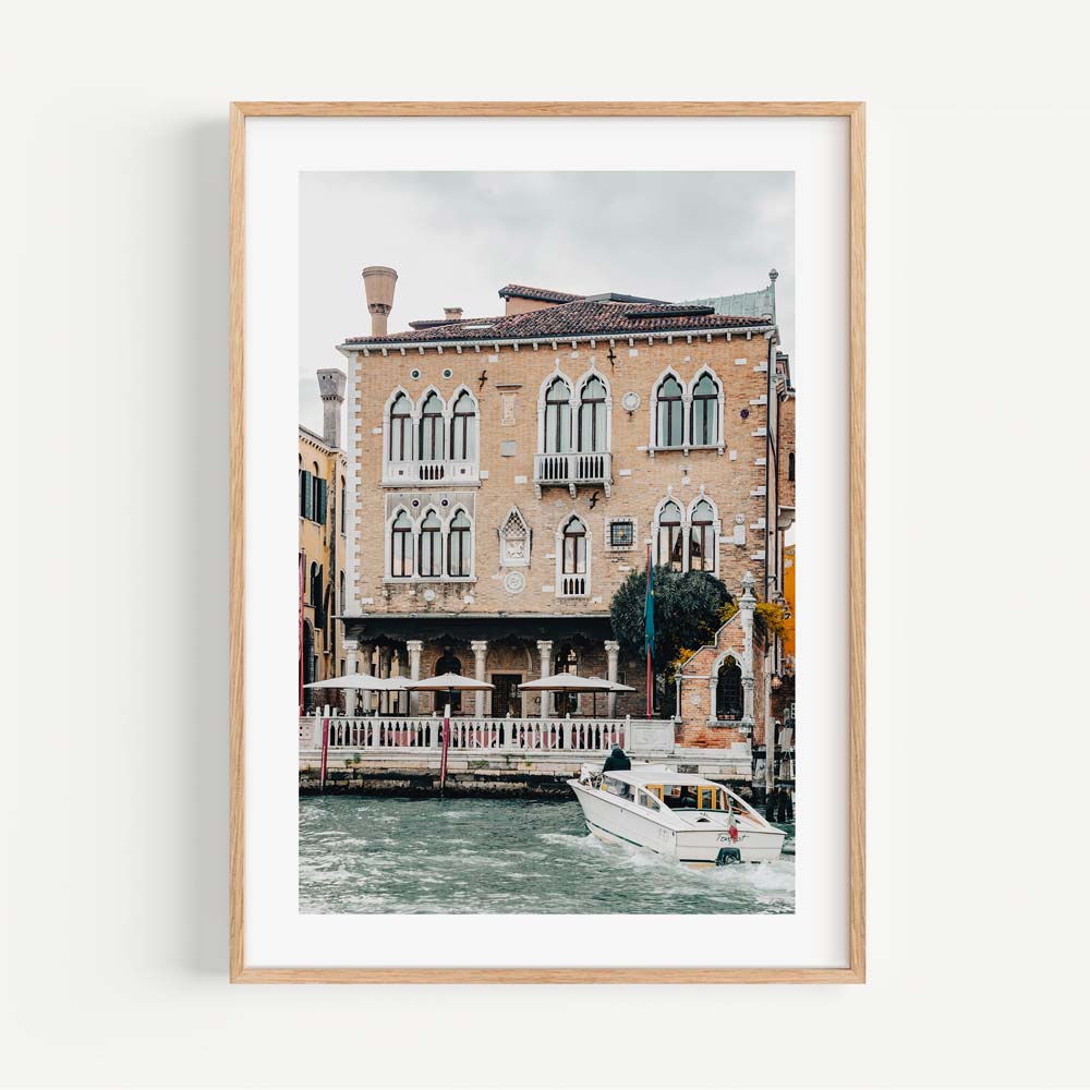 Charming Venetian Waterfront with Boat and Historic Architecture