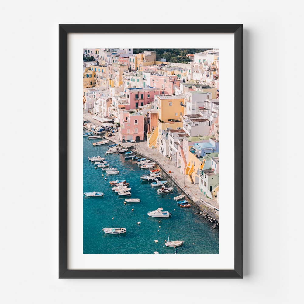 Vibrant Coastal Scene of Procida with Colorful Houses and Boats on Blue Water