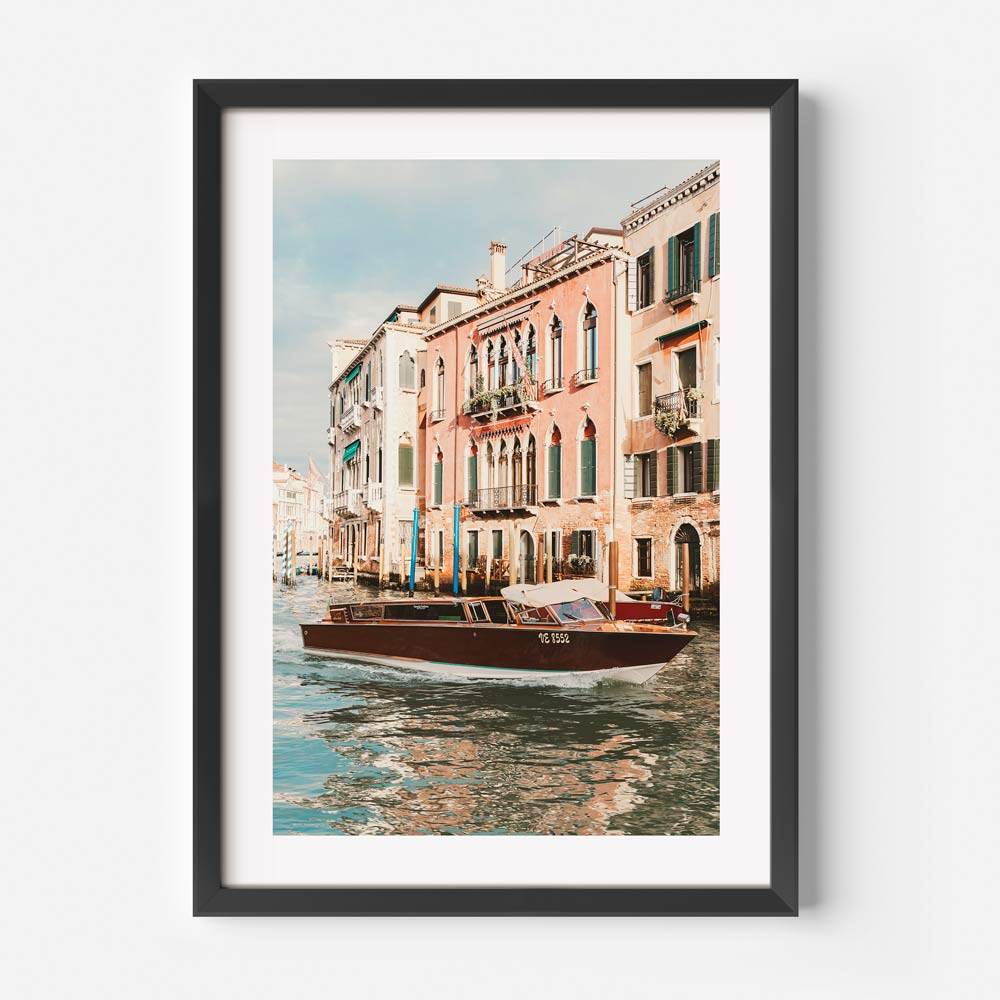 Venetian Waterway Serenity: Charming Boat on Canals with Historic Buildings
