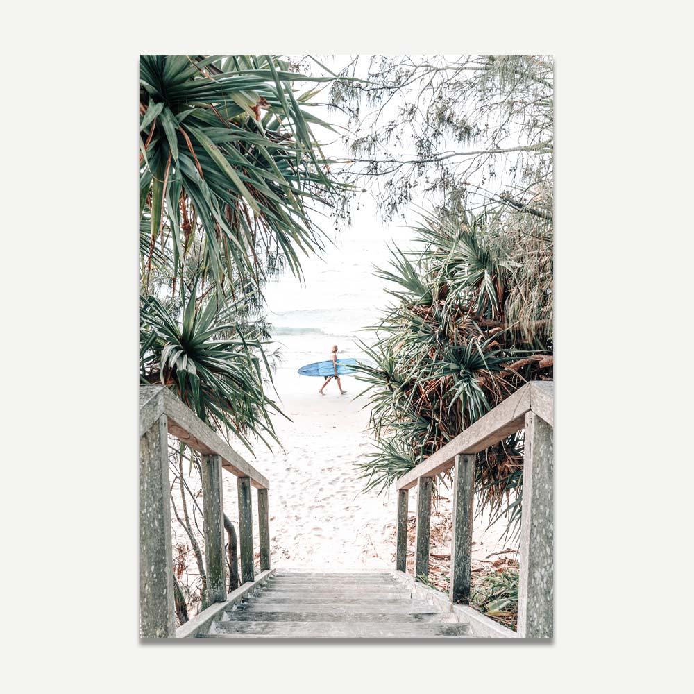 Coastal Serenity: Surfer Strolling Down Tropical Beach Path
