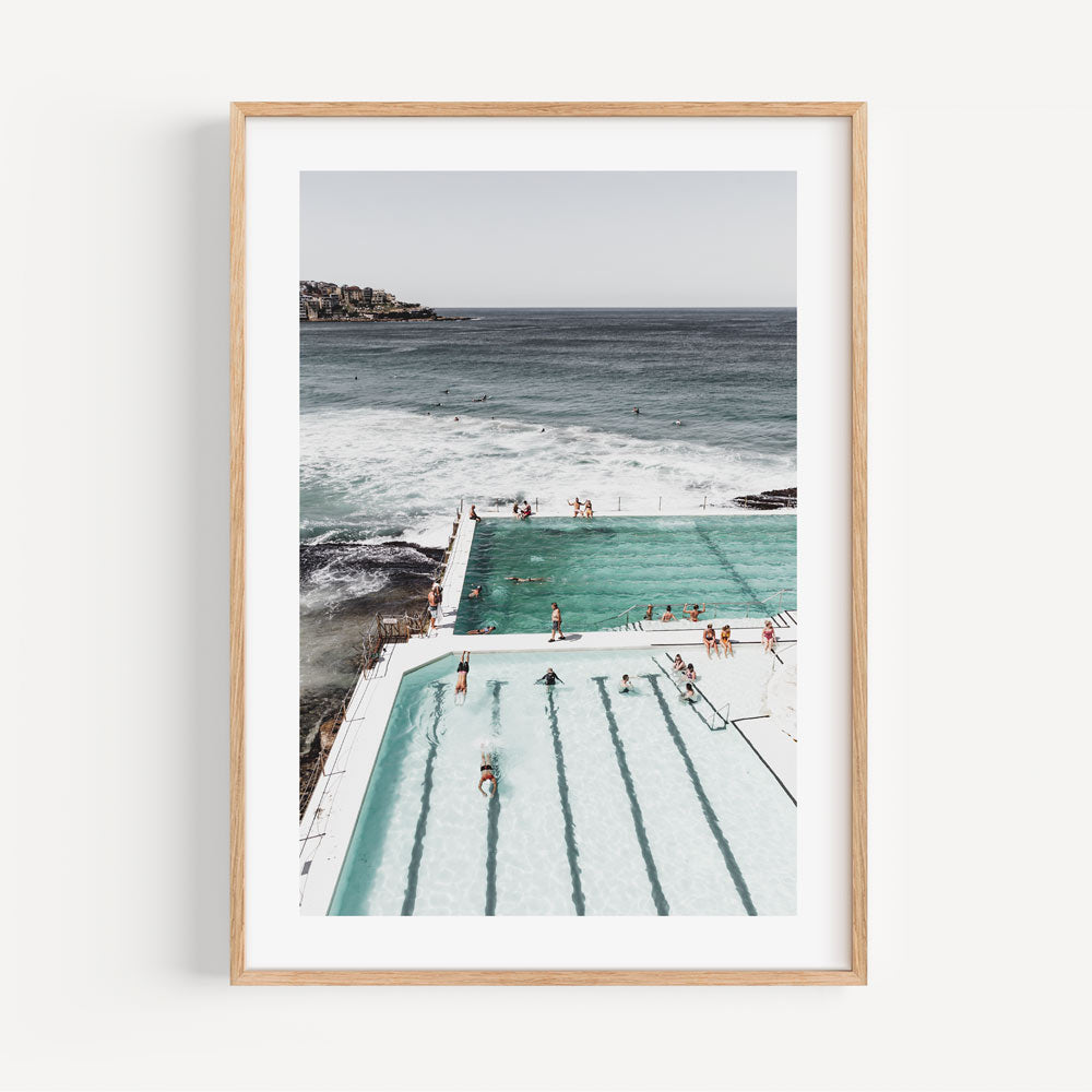 Serene Ocean Poolside Retreat with Bathers and Majestic Waves