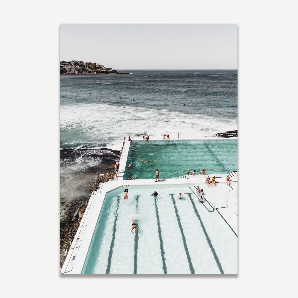 Serene Ocean Poolside Retreat with Bathers and Majestic Waves