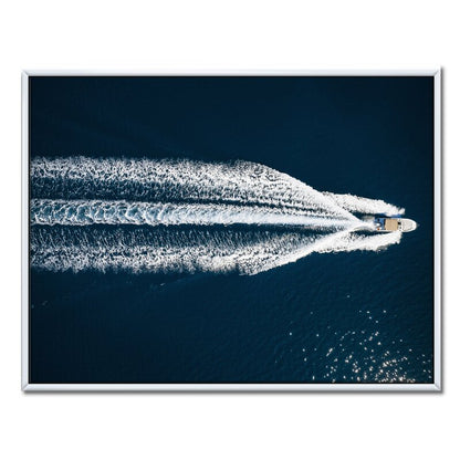 Serene Aerial View of a Speedboat Gliding Across the Mediterranean Waters