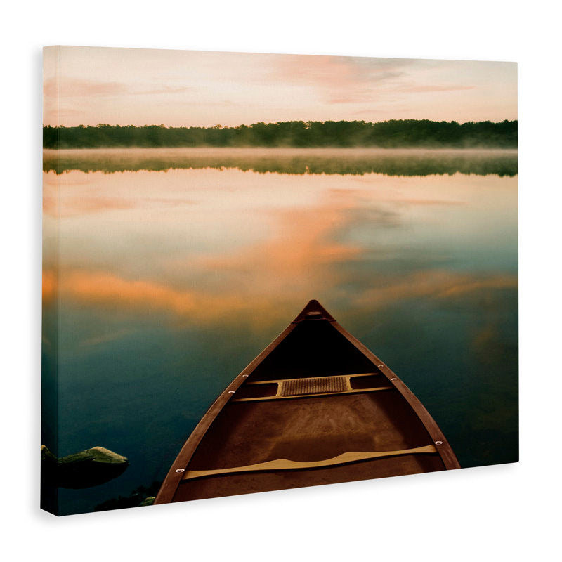 Tranquil Canoe at Sunrise on Serene Lake with Stunning Water Reflection
