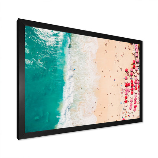 Aerial View of Serene Coastal Beach with Colorful Umbrellas and Turquoise Waters