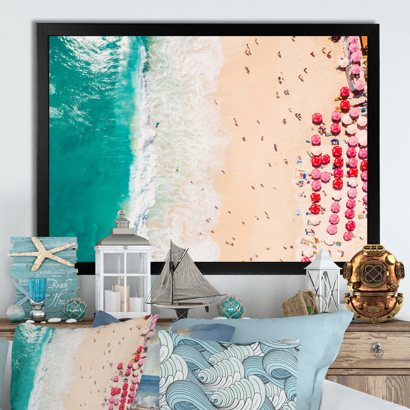 Aerial View of Serene Coastal Beach with Colorful Umbrellas and Turquoise Waters