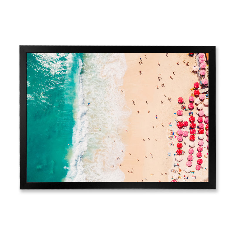 Aerial View of Serene Coastal Beach with Colorful Umbrellas and Turquoise Waters