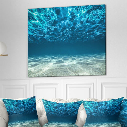 Tranquil Underwater Scene with Crystal Clear Waves and Soft Sandy Bottom