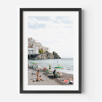 Vibrant Amalfi Coast Beach Scene with Relaxed Bathers and Scenic Views