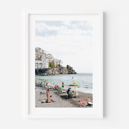Vibrant Amalfi Coast Beach Scene with Relaxed Bathers and Scenic Views