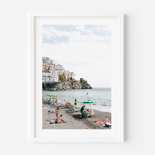 Vibrant Amalfi Coast Beach Scene with Relaxed Bathers and Scenic Views