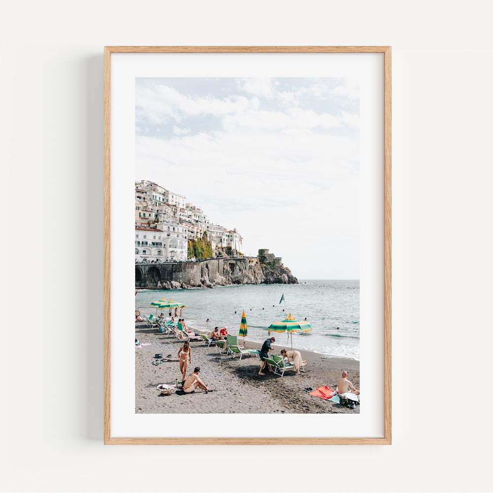 Vibrant Amalfi Coast Beach Scene with Relaxed Bathers and Scenic Views