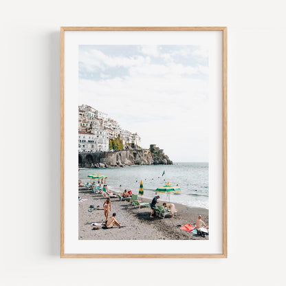 Vibrant Amalfi Coast Beach Scene with Relaxed Bathers and Scenic Views