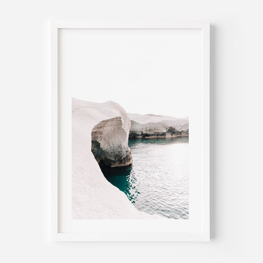 Serene Coastal Landscape: Vibrant Azure Waters and Majestic Stone Formations
