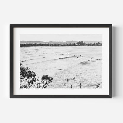 Serene Ocean Waves with Surfers in Black and White Art Print
