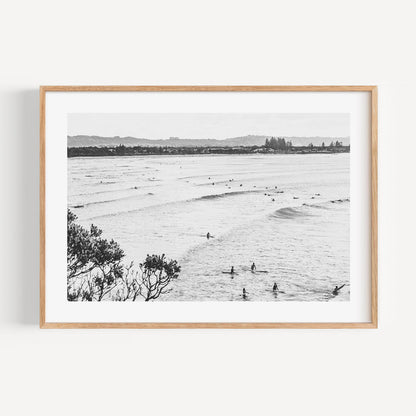 Serene Ocean Waves with Surfers in Black and White Art Print