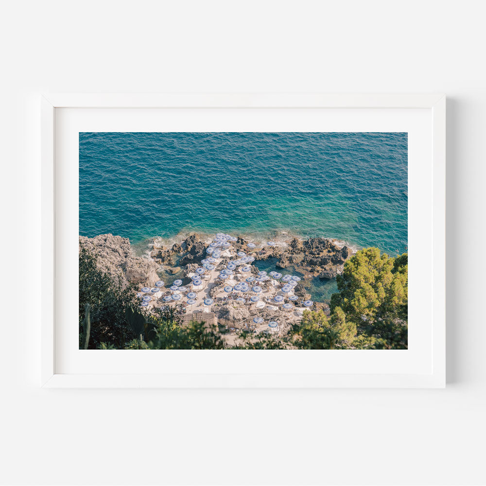 Serene Capri Beach Scene with Coastal Umbrellas and Azure Waters