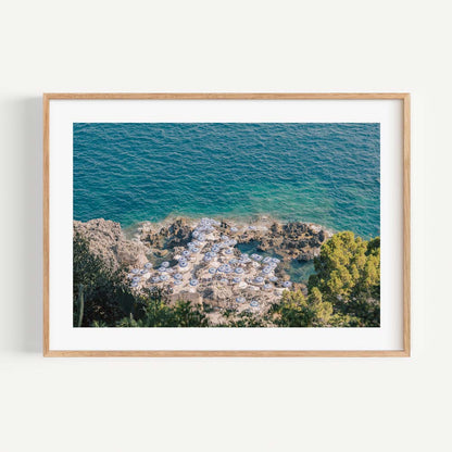 Serene Capri Beach Scene with Coastal Umbrellas and Azure Waters