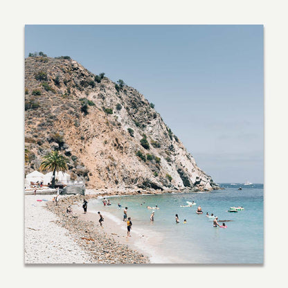 Tranquil Beach Scene with Sunbathers and Clear Waters