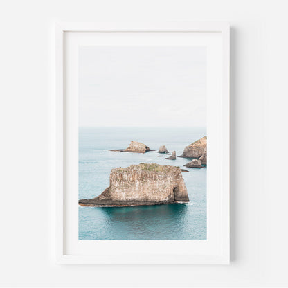 Serene Coastal Landscape with Majestic Rock Formations and Tranquil Waters
