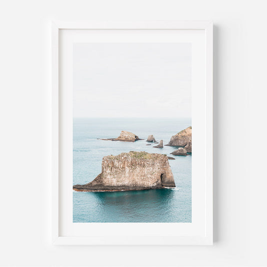 Serene Coastal Landscape with Majestic Rock Formations and Tranquil Waters