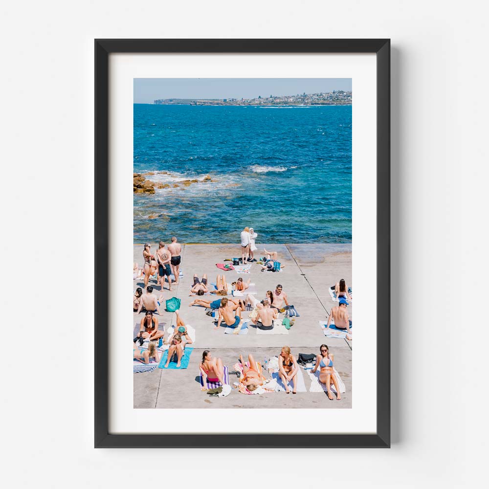 Vibrant Beach Day at Clovelly: Sunbathers by the Ocean