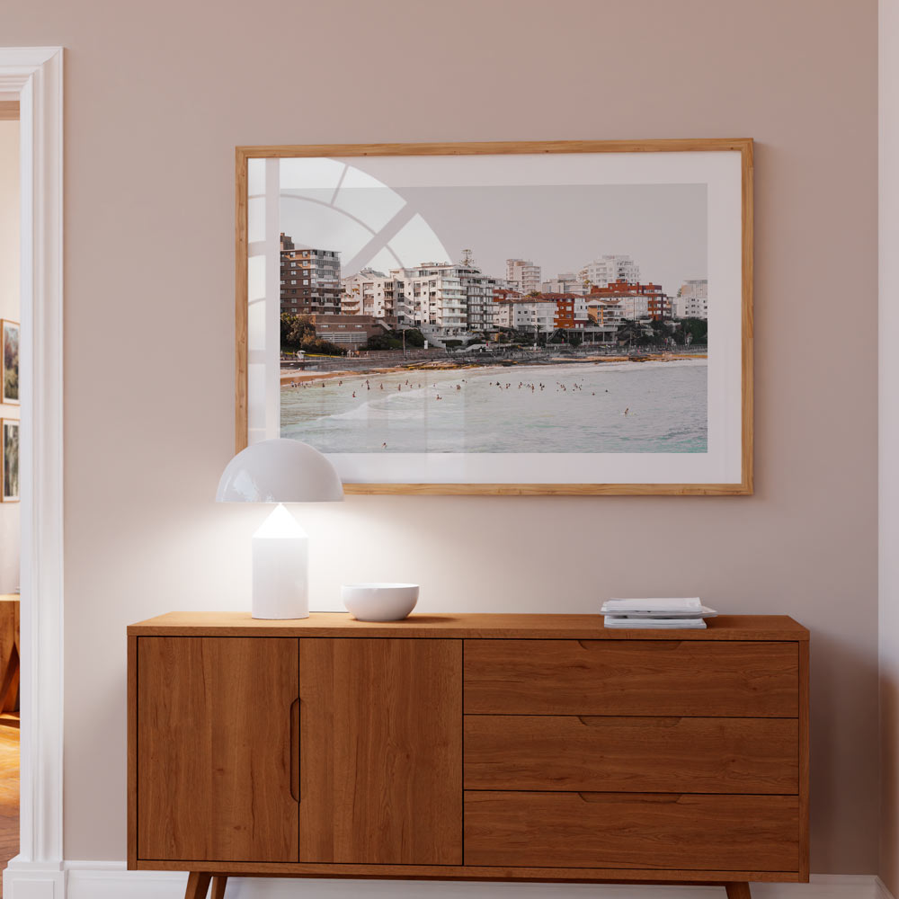 Serene Cronulla Beach Scene with Coastal Waves and Urban Skyline