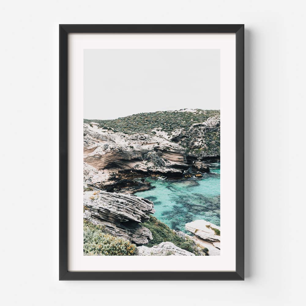 Serene Coastal Landscape with Crystal Clear Waters and Rugged Cliffs