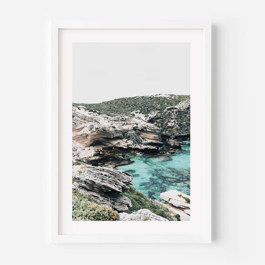 Serene Coastal Landscape with Crystal Clear Waters and Rugged Cliffs