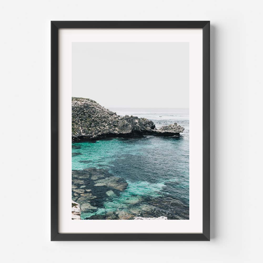 Serene Coastal View with Crystal Clear Water and Lush Greenery