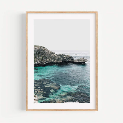 Serene Coastal View with Crystal Clear Water and Lush Greenery