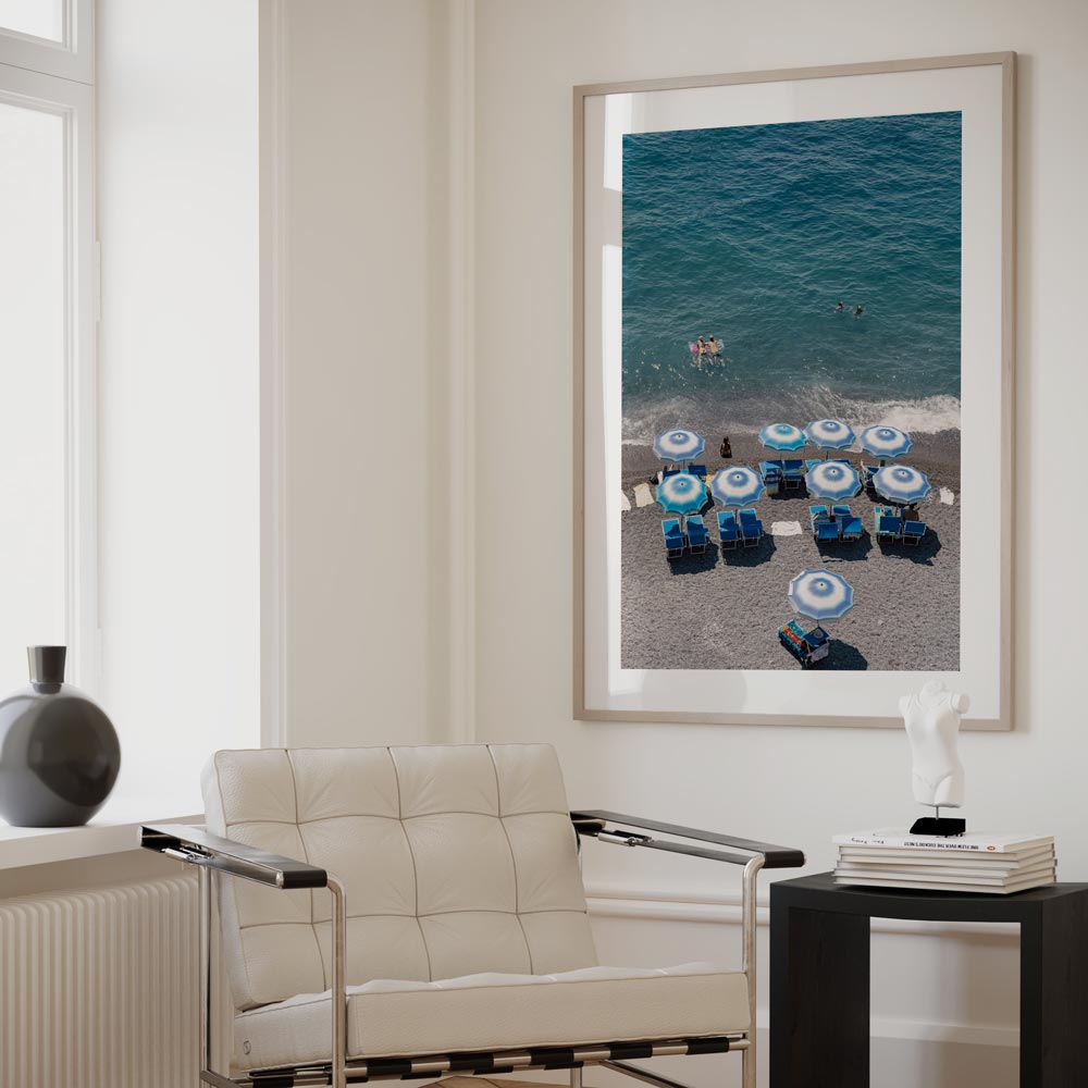 Vibrant Beach Scene with Blue Umbrellas and Swimmers