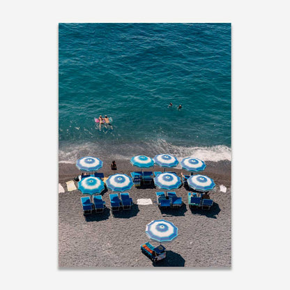 Vibrant Beach Scene with Blue Umbrellas and Swimmers